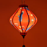 Glowing Lozenge lantern with Vietnamese woman wearing nón lá hats and carrying lanterns with a warm red glow.