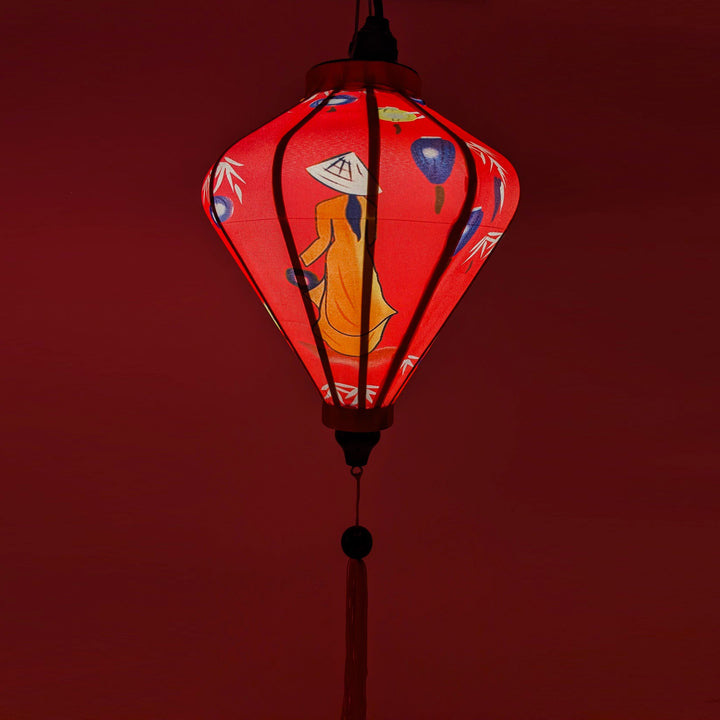 Handcrafted red Hoi An silk lantern with pink rose floral design, traditional Vietnamese home decor and cozy lighting.

