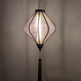 Hanging grey jacquard silk lantern with light bulb inside creating a grey glow 