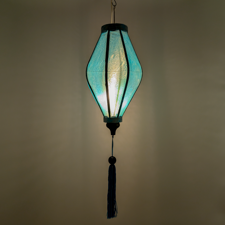 Traditional glowing jacquard silk lantern hanging with a tassel.