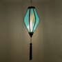 Traditional glowing jacquard silk lantern hanging with a tassel.