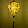 Glowing balloon shaped mustard Jacquard silk lantern.