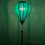 Balloon shaped lantern created in Teal green jacquard silk with hints of blue creating a green glow.