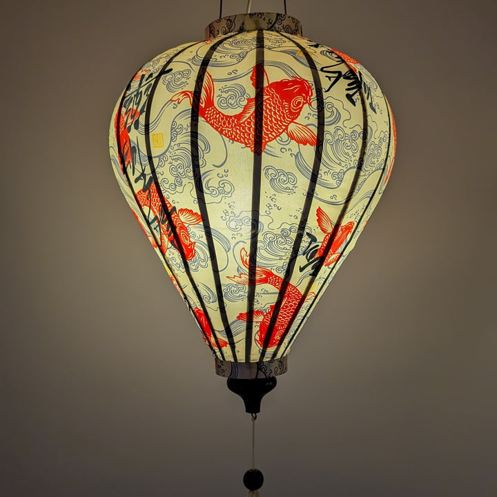 Vietnamese silk lantern with koi fish design and calligraphy on a cream background