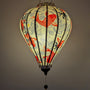 Vietnamese silk lantern with koi fish design and calligraphy on a cream background