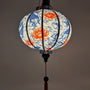 Handmade glowing Hoi An lantern featuring koi fish and vibrant red lotus flowers, symbolizing luck and prosperity.
