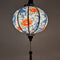 Handmade glowing Hoi An lantern featuring koi fish and vibrant red lotus flowers, symbolizing luck and prosperity.
