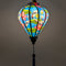 A glowing balloon shape Vietnamese lantern featuring a vibrant blue background adorned with grey-crowned cranes standing among large green lotus leaves, handmade in Hoi An.
