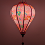 Glowing pink lantern with colourful designs.