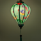 Glowing balloon shape lantern with delicate petals, lush green leaves and detailed lotus seed pods in shades of pink, blue, and yellow create a gorgeous contrast.