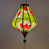 Soft glowing silk lantern with pink lotus flowers on white background perfect decor for the garden or patio.