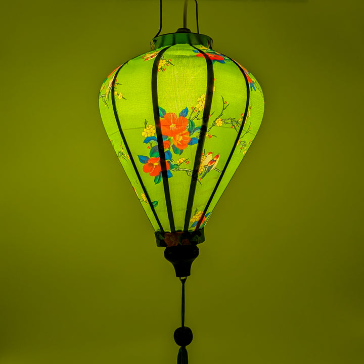 Glowing Balloon shaped lantern creating a stunning green hue of light when lit from inside using an external light source.