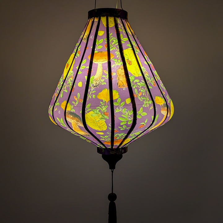 Glowing lantern with floral and mushroom pattern on a rich purple.