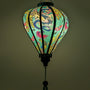 A glowing Vietnamese silk lantern featuring a vibrant blue background with majestic dragons and elegant peacocks. 