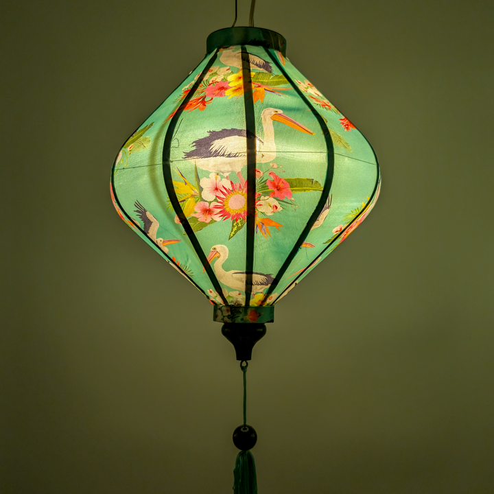 Glowing  lantern with floral and bird design on a teal colour background