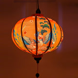 Gorgeous pink hue created when lighting this Vietnamese silk lantern from inside.