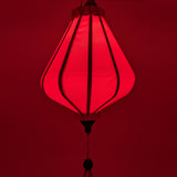 Up close of glowing Plain pink Vietnamese lantern with pink glow perfect for special occasions.