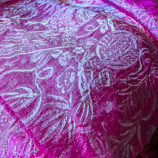 up close of pink and silver jacquard silk fabric