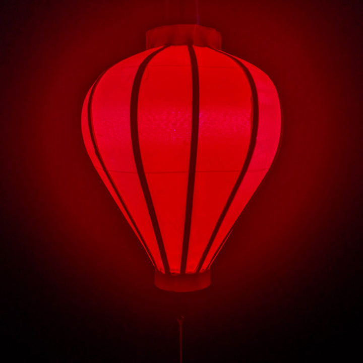 Glowing balloon shape red Vietnamese silk lantern.