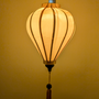 Plain Gold Silk lantern with a warm glow.
