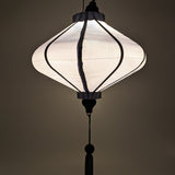 Glowing UFO shaped lantern in plain grey super silk.