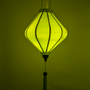 Plain silk Lime Green hanging lantern with lightbulb inside creating a green glow.
