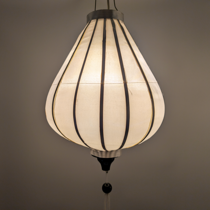 Glowing garlic shaped white plain Vietnamese silk lantern.