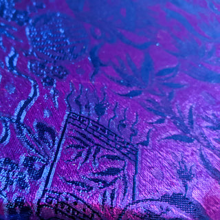 close up of purple and blue jacquard silk fabric