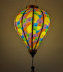 Balloon shaped lantern with fractal print glowing from a lightbulb inside.