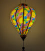 Balloon shaped lantern with fractal print glowing from a lightbulb inside.