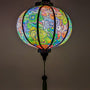 Artisan-crafted silk lantern featuring a mesmerizing paisley print in multicolor hues.
