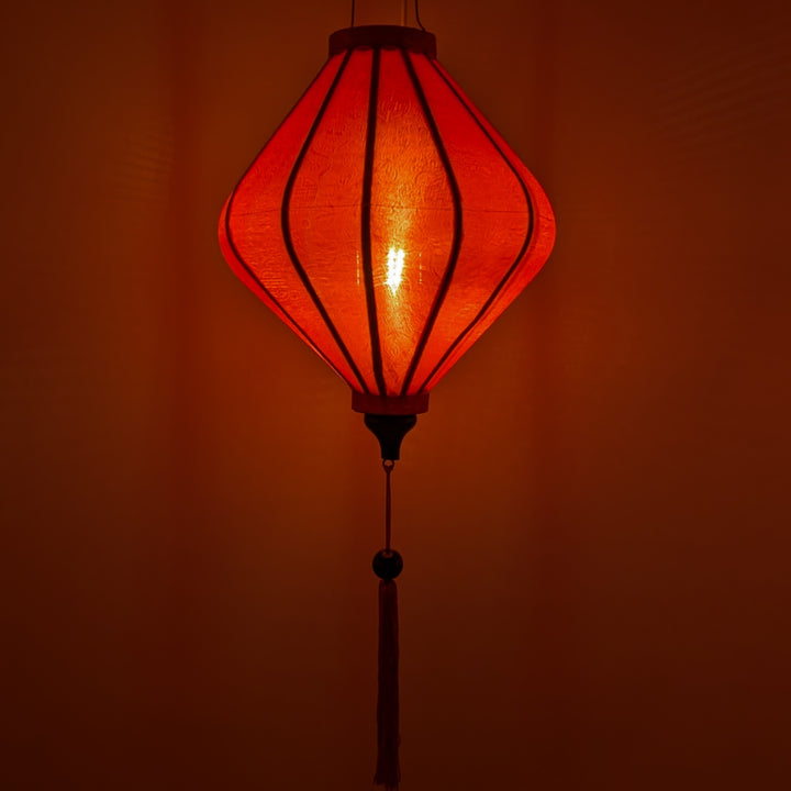 Glowing red lantern with a tassel 
