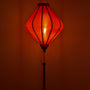 Glowing red lantern with a tassel 