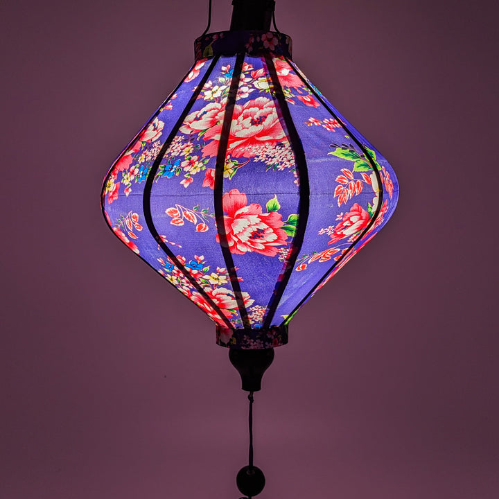 Glowing elegant purple silk lantern with hand-painted pink roses, perfect for home, balcony, or festive decor.
