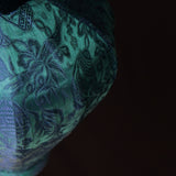 A close up of a jacquard silk Vietnamese lantern handmade in Hoi An, Vietnam.