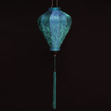 balloon shape lantern made with royal blue and teal jacquard silk fabric with matching blue tassel