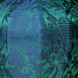 A close up of royal blue and teal colour jacquard silk fabric.