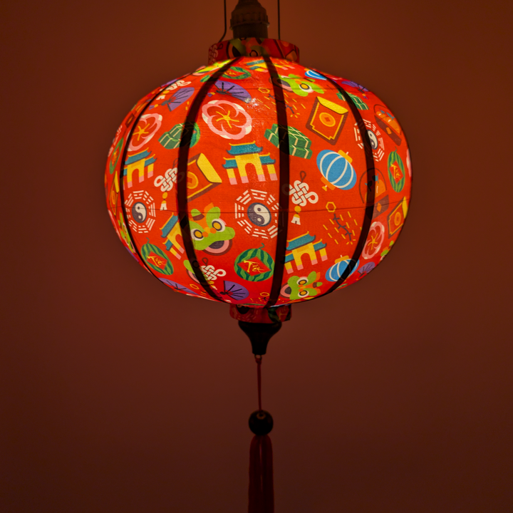 Colourful Tet theme lantern with patterns on a red background