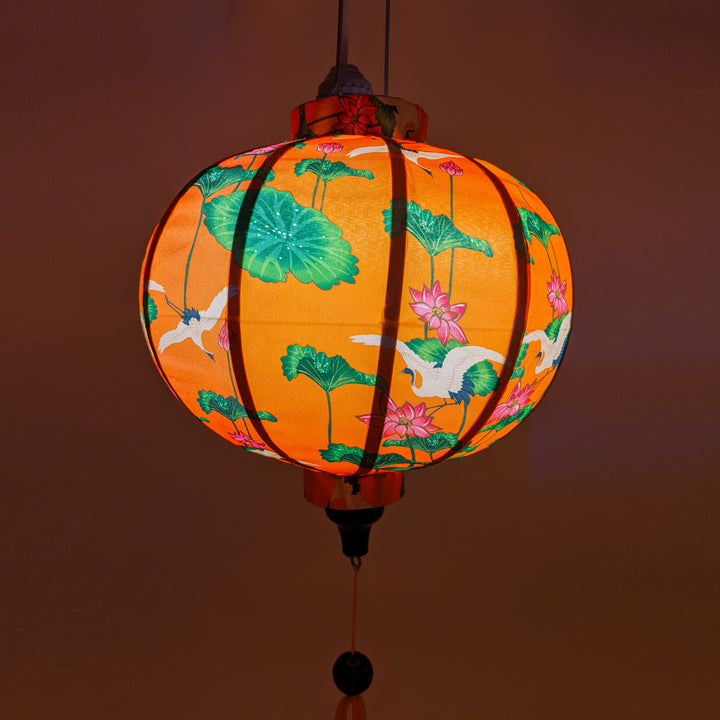 Round Vietnamese lantern with a gorgeous orange glow.