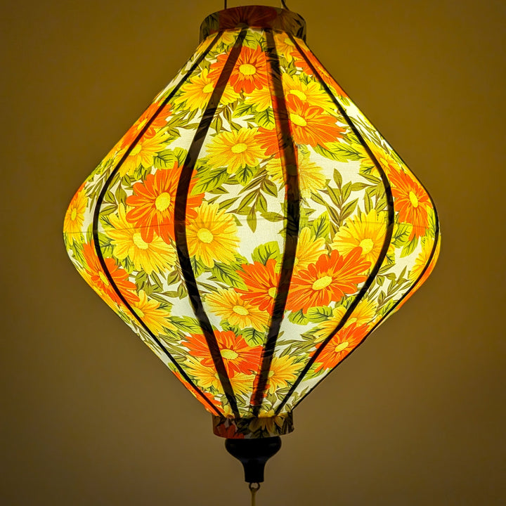 Lantern with floral pattern creating a yellow glow.