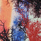Polyester silk fabric with silhouettes of winter-bare branches in vibrant hues of orange, red, and blue. Used to create Vietnamese silk lanterns.