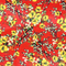Red polyester silk fabric with a print of yellow flower blossoms with hints of green and white.
