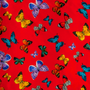 Polyester silk fabric with multi-coloured butterfly pattern on a vibrant red background, used for hand making Vietnamese lanterns.