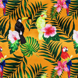 Orange polyester silk fabric with exotic birds parrots, toucans, and cockatiels, as well as flowers like pink hibiscus and orchids, and lush palm leaves