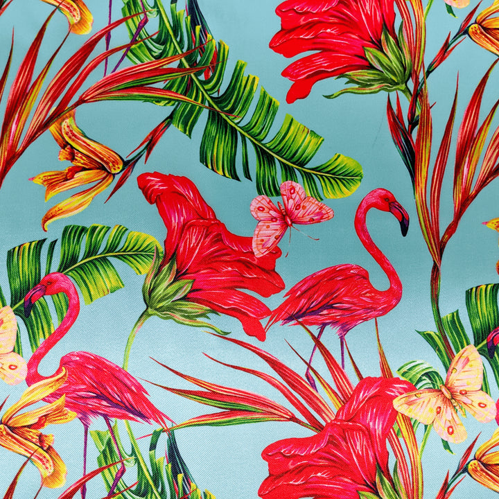 Polyester silk fabric used to create Hoi An Vietnamese lanterns with a print of pink flamingos, green leaves, flowers, pink and yellow butterflies on a light blue.