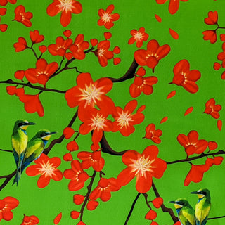 Green polyester silk fabric with kingfishers on the hunt in a tree with red flowers.