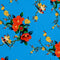 Polyester silk fabric with love birds sitting in a tree with red and yellow flowers on a bright blue background.