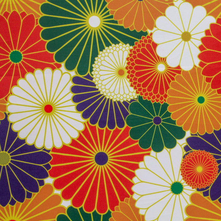 Polyester silk fabric with flowers in a retro colour palette of orange, white, green, and dark blue.