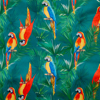 Deep green polyester silk fabric with a print of parrots in vivid colours surrounded by palm leaves.