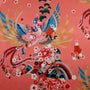 Pink polyester silk fabric with large phoenix bird rising with blue, gold, and pink wings.